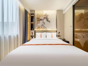 Letto o letti in una camera di GreenTree Eastern Hotel Nanjing Jiangning University