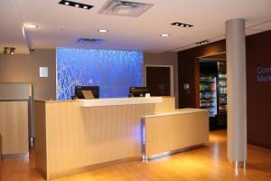 an office with a reception counter with a blue wall at Fairfield by Marriott Inn & Suites Jonestown Lebanon Valley in Jonestown