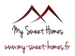 un texto negro de letra mis dulces casas y montañas en My Sweet Homes - Le 15, en Colmar