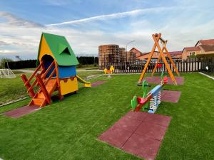 a playground with many different types of play equipment at Zlatni Lug in Požega