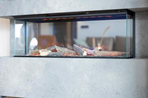 a glass oven with meat and other food on it at Weitblick Winterberg in Winterberg