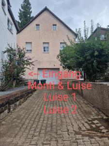 a sign on the side of a house at Monteurwohnung Monti 1 in Saarbrücken +4 photos