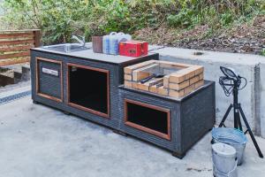 a black stove with a sink and boxes on it at Little Hermit - Vacation STAY 39645v in Tateyama
