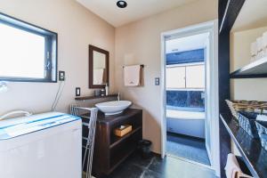 a small bathroom with a sink and a mirror at Little Hermit - Vacation STAY 39645v in Tateyama