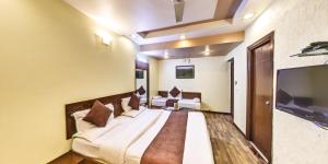 Кровать или кровати в номере Hotel Vishram