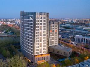 a view of a large building in a city at GreenTree Eastern Hotel Tianjin Wuqing Wanda Plaza in Wuqing