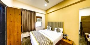 Hotel Vishram客房内的一张或多张床位