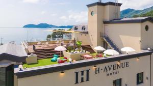 a hotel with a view of the water at Geoje Mongdol Beach H Avenue Hotel in Geoje