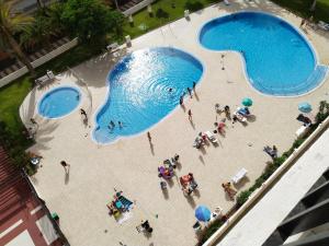 Utsikt över poolen vid Los Cristianos appartement Orange trees vue mer panoramique eller i närheten
