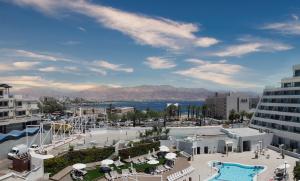 a view of a resort with a swimming pool at Beach Side- Ceasar Luxury Amazing Pool Eilat in Eilat