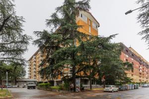 a large tree in front of a building at Casa Limone by Wonderful Italy in Bologna
