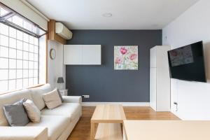 TV a/nebo společenská místnost v ubytování HOMEABOUT MADRID RÍO APARTMENT