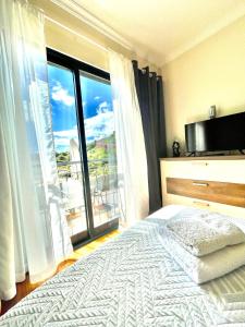 Postel nebo postele na pokoji v ubytování Plaza Charming Flat