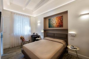 Postel nebo postele na pokoji v ubytování AGAVE B&B