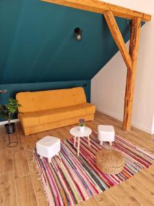 a living room with a couch and two tables at Casa Ileana 