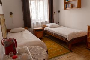 Posteľ alebo postele v izbe v ubytovaní Kolory Guest House