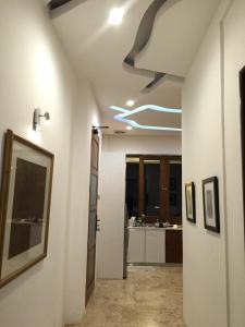a room with a hallway with a sink and a bathroom at De Summit Villa & View in Puncak +44 photos