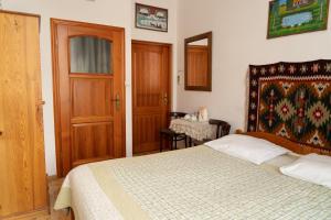 Posteľ alebo postele v izbe v ubytovaní Kolory Guest House