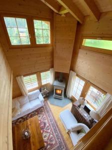 an overhead view of a living room in a log cabin at Chalet with style in the beautiful Val Ferret in Praz-de-Fort