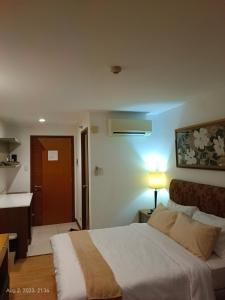 Llit o llits en una habitació de Tuti's Studio at One Tagaytay