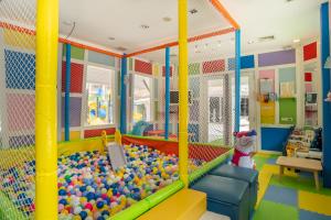 a play room with a pool and balls at Heeton Concept Hotel Pattaya by Compass Hospitality in Pattaya