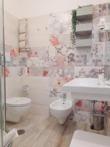 a bathroom with a toilet and a sink at Il Mare Di Roma in Lido di Ostia
