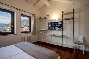 a bedroom with a bed and a window at DIMORA VERGER in Aosta
