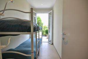 a hallway with bunk beds in a house at Casa Riva - Few minutes from beaches in Rapallo