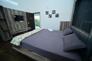 Postel nebo postele na pokoji v ubytování Archana Resorts