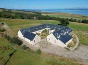 an aerial view of a building in a field at Bracken Cottage in Killean