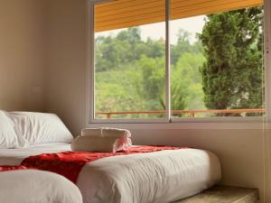 Postel nebo postele na pokoji v ubytování Baan Daeng Resort บ้านรักไทย