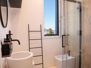 Et badeværelse på AMARE Luxury Apartment