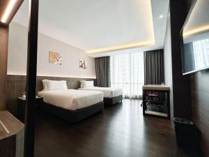 Postel nebo postele na pokoji v ubytování Jazz Hotel Penang + 36 fotografií