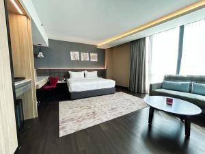 Postel nebo postele na pokoji v ubytování Jazz Hotel Penang