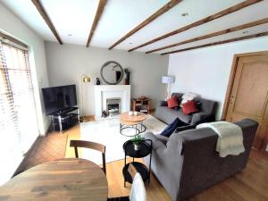 Χώρος καθιστικού στο Heather Cottage Luss