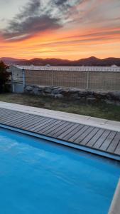 a view of a swimming pool at sunset at Villa Playa del Sol - B1 in Saint-Tropez