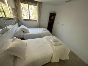 Postel nebo postele na pokoji v ubytování Penthouse Puerta de Pedregalejo