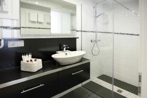 Koupelna v ubytování Hotel Cupidor + 37 fotografií