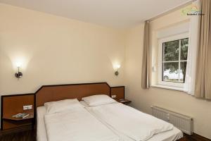 Postel nebo postele na pokoji v ubytování Boddenhof Stedar