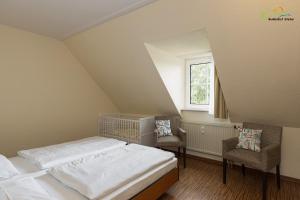 Postel nebo postele na pokoji v ubytování Boddenhof Stedar