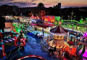 an image of a carnival at night with people at Studio ZEN SUD Plage à pied Pin Rolland Sablettes in Saint-Elme