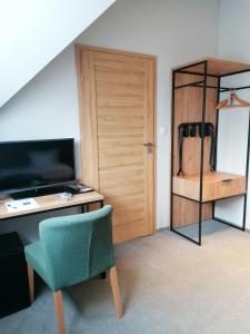 Ein Bett oder Betten in einem Zimmer der Unterkunft FOLGA - Hotel, Restauracja, Browar, SPA