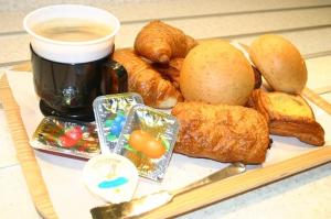 a plate of food with a cup of coffee and pastries at Hotel Alpha-One Kitashinsaibashi in Osaka