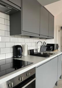 Kuchyň nebo kuchyňský kout v ubytování OneFiveSix - Unique Apartments Birmingham