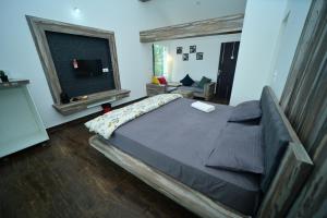 Postel nebo postele na pokoji v ubytování Archana Resorts