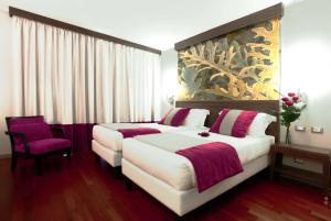 A bed or beds in a room at Ramada Plaza by Wyndham Milano
