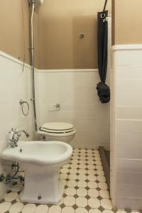 a bathroom with a toilet and a bidet at Locanda Dolcevita in Dozza