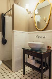 a bathroom with a sink and a mirror at Locanda Dolcevita in Dozza