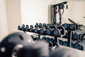 a row of dumbbells in a gym at Hotel Puerto Sherry in El Puerto de Santa María