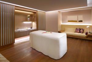 Postel nebo postele na pokoji v ubytování Hyatt Regency Tianjin East